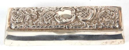 Edward VII silver trinket box of sarcophacus form, the hinged lid embossed with scrolls and mesh