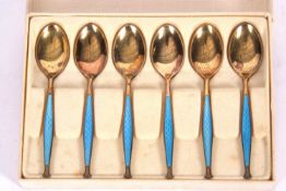 Cased set of six Norwegian silver gilt and blue enamelled coffee spoons by David Andersen