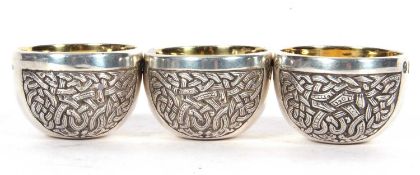 Three Irish silver heavy open salts of squat circular form, either sides engraved with a Celtic