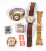 A mixed lot of four wristwatches and a metal stamp box. The watches include a Newark, a Zodiac, a