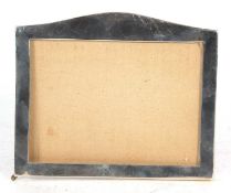 George V plain silver mounted photograph frame, rectangular shape with arched top, oak easel back,