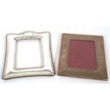 Mixed Lot: A 20th Century white metal framed photograph frame with limited engraved decoration,