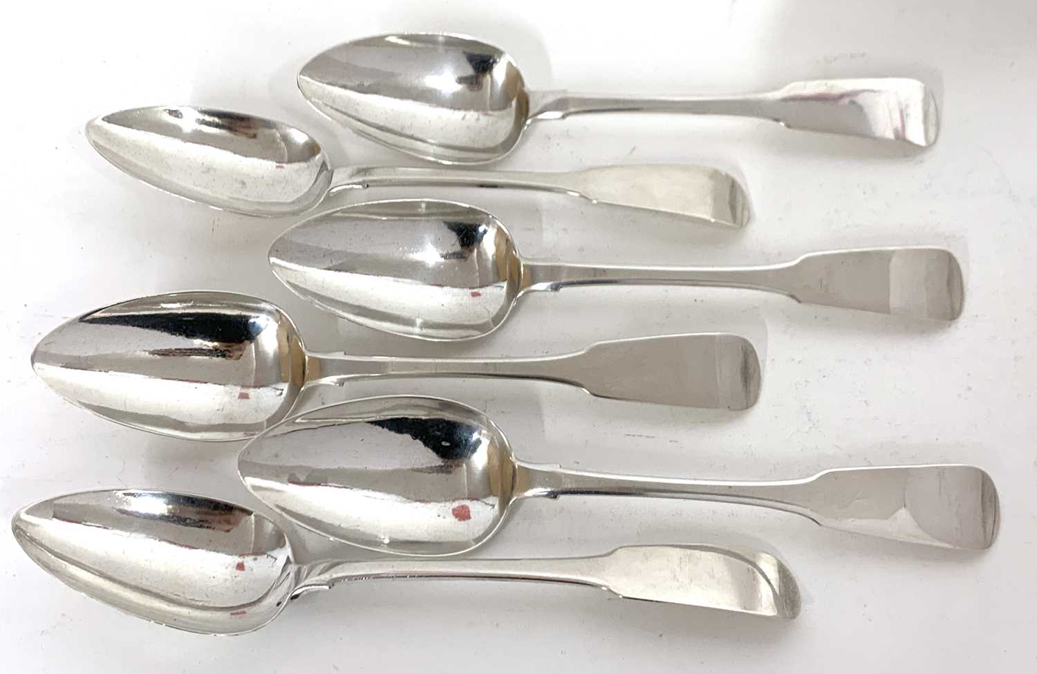 Six Irish silver Fiddle pattern and rat-tail table spoons, 5 hallmarked for Dublin 1815, one 1814,