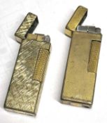 Two gold plated Dunhill gas lighters, each approx 6cm x 2.5cm, one with leather case, fair condition