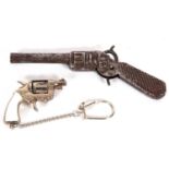 Mixed Lot: Tin plate model of a revolver stamped 'Edi' and 'DRP', 13cm long together with a