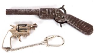 Mixed Lot: Tin plate model of a revolver stamped 'Edi' and 'DRP', 13cm long together with a