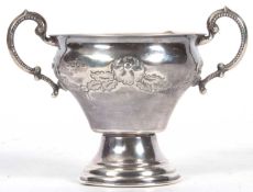 George V silver twin handled vase of baluster form, the body decorated with a garland of flowers and