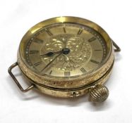 A yellow metal pocket watch, converted to a wristwatch, 35mm case including the crown, stamped 14k