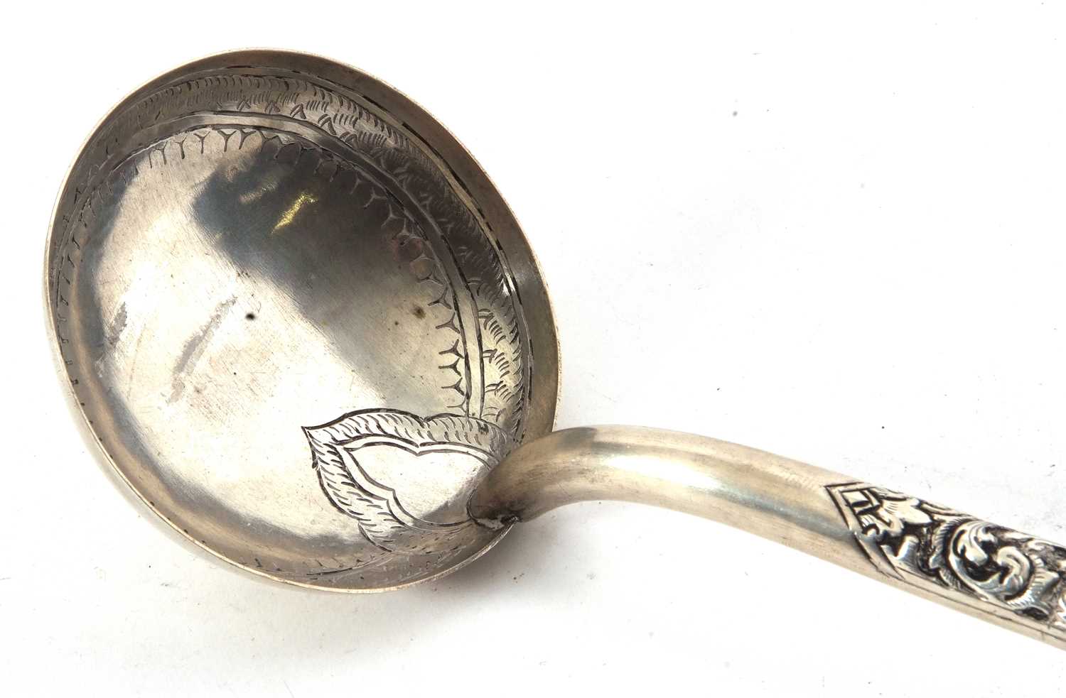 North African white metal ladle with engraved circular bowl chased hollow handle and pointed finial, - Image 2 of 5