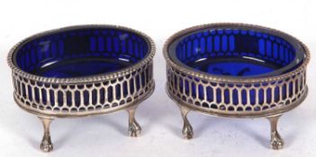 Pair of Victorian open salts of oval form, the pierced bodies with a vacant cartouche and a
