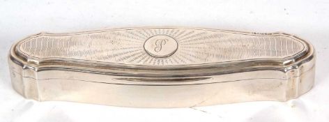 A George V silver trinket box of shaped elongated form, the hinged lid with engine turned decoration
