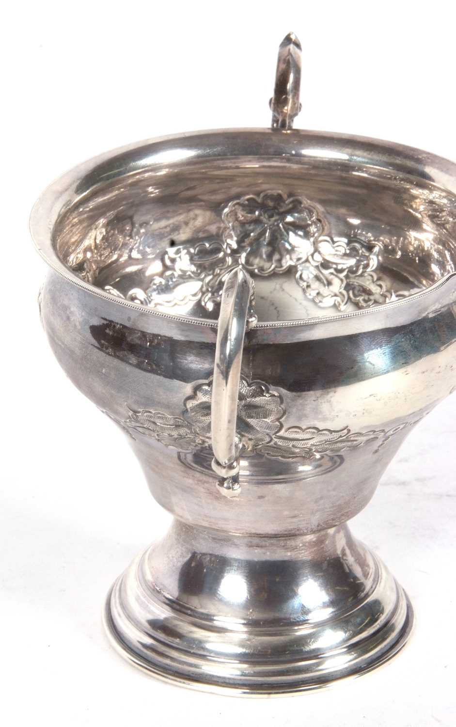 George V silver twin handled vase of baluster form, the body decorated with a garland of flowers and - Image 3 of 4