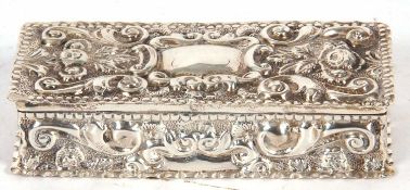 Victorian silver trinket box of rectangular form, overall embossed with shells and foliage and