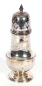 Elizabeth II baluster caster of typical form, the pierced domed top with urn finial, 17cm tall,