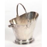 Interesting Edwardian sugar holder in the form of a coal scuttle having swing handle, oval foot (
