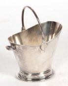 Interesting Edwardian sugar holder in the form of a coal scuttle having swing handle, oval foot (