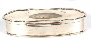 Edward VII silver trinket box of plain shaped oval form, the hinged lid with a domed centre, the