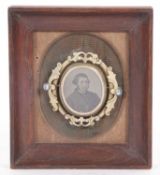 Victorian metal framed oval swivel brooch featuring to the centre a photo portrait of a gentleman,