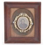 Victorian metal framed oval swivel brooch featuring to the centre a photo portrait of a gentleman,