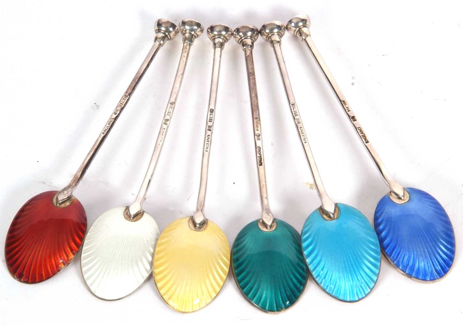 Cased set of six Elizabeth II coffee spoons with harlequin enamel backs to the shell bowls, bos