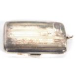 George V ladies cigarette case of curved rectangular form with banded engine turned decoration to