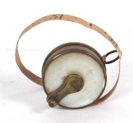 Late 19th/early 20th Century brass and mother of pearl mounted dress makers tape measure (3 ft), 2.