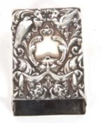 Late Victorian matchbox holder of rectangular form, the lid heavily embossed with satyr mask, swags,