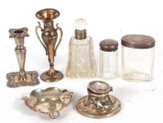 Mixed Lot: George V single embossed candle stick, Birmingham 1924, 12cm tall, a silver ashtray