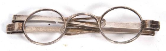 A cased pair of Georgian folding spectacles with circular lenses probably London 1804