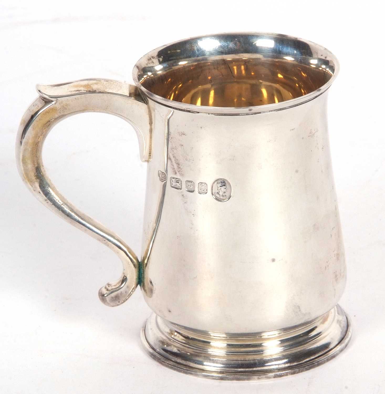 Elizabeth II half pint tankard of circular baluster form, hollow looped handle, inscribed with