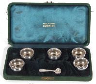 Cased set of five early 20th Century American sterling silver salts of cauldron form with beaded