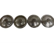 Four MG hub caps (possibly from a Magnette)