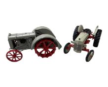 Two metal models of Fordson tractors