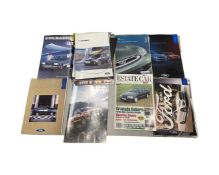 Approximately 15 Ford sales brochures and manuals