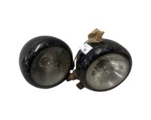 Pair of black vintage Hella car lights