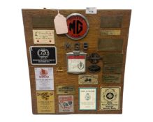 Wooden display board with various plaques and badges for MG, local interest, Country Fairs etc