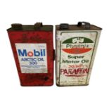 Two one gallon oil cans, Mobil and Arctic, together with a Pheonix Super motor oil