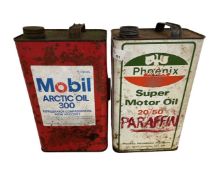 Two one gallon oil cans, Mobil and Arctic, together with a Pheonix Super motor oil