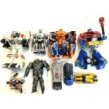 A mixed lot of retro plastic action figures to include:- Optimus Prime- Optimal Optimus: Ape Face-