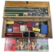 A large wooden box of mixed vintage Meccano, instruction manuals, motors etc