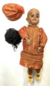 A Simon & Halbig bisque head doll, formed as an Indian girl with flirty eyes operated by a string at