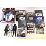 A large mixed lot of modern Star Wars merchandise to include: - A boxed R2-D2 3D Battery powered