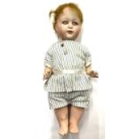 A rare Heubach bisque head doll, in striped outfit. Close-mouthed, blue eyes (damage to eyelids),