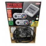 A boxed Super Nintendo Entertainment System (SNES): Nintendo Classic Mini, with 2 gamepads and 20