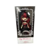 A modern boxed Japanese changing eye-colour doll by Tang Kou