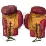 A pair of vintage red leather laced boxing gloves, marked Eton 8oz