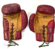 A pair of vintage red leather laced boxing gloves, marked Eton 8oz