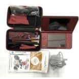 A burgundy Nintendo DS XL console in case with accessories, to include: - USB Cable - Charging
