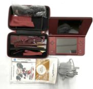 A burgundy Nintendo DS XL console in case with accessories, to include: - USB Cable - Charging