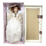 A boxed Limited Edition Kensington Collection porcelain doll formed as a lady in cream dress with